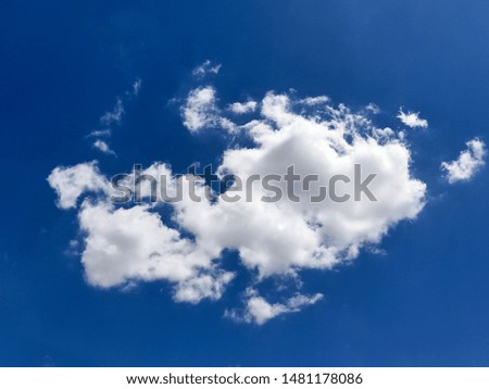 White clouds in the deep blue sky
