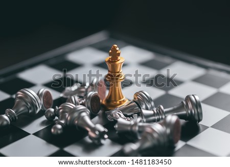 Gold Chess game king staying victory on chessboard,Business planing strong concept with black background