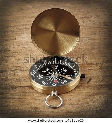 compass on a wooden background