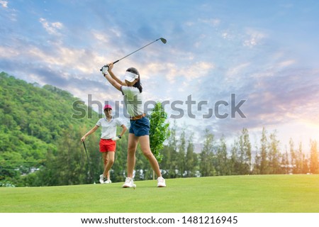 Golf ball on green grass ready to be struck at golf club,close up in golf coures at Thailand Royalty-Free Stock Photo #1481216945