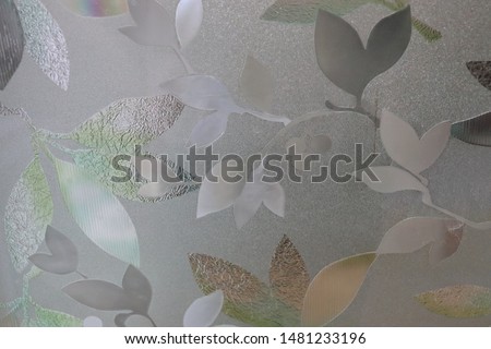 Close-up flower picture of decorative window film for attach on glass surface which blur background.using as background or wallpaper