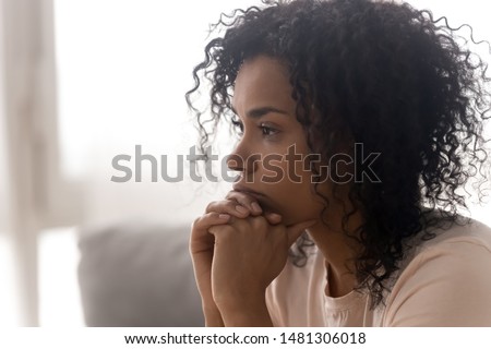 Close up side profile view of pensive young african American woman thinking of relationships problems, thoughtful black biracial female feel despair lost in thoughts consider life trouble or drama Royalty-Free Stock Photo #1481306018