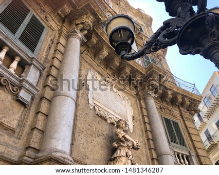 Detail of monument with lamppost, statue, Palermo Italy