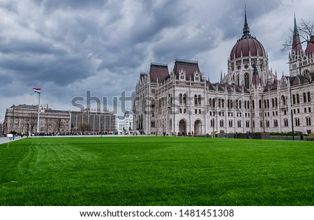 The Hungarian Parliament Building viewed from the grass covered Kossuth Square on a cloudy autumn afternoon Royalty-Free Stock Photo #1481451308