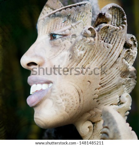 Double exposure profile portrait of young smiling female traveller combined with close up of a rock sculpture from a Balinese temple in southeast asia
