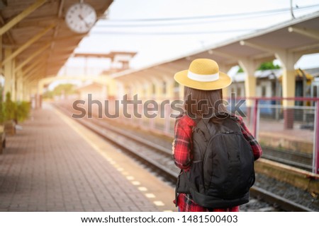 Asian girl photographer taking pictures while traveling