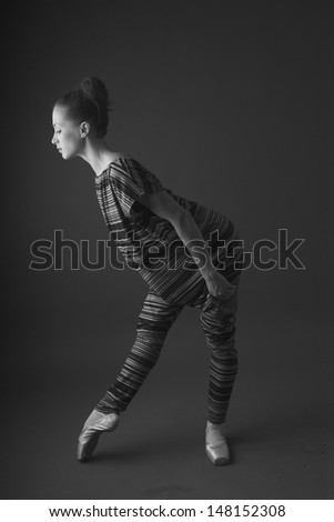 Ballerina in studio, monochrome