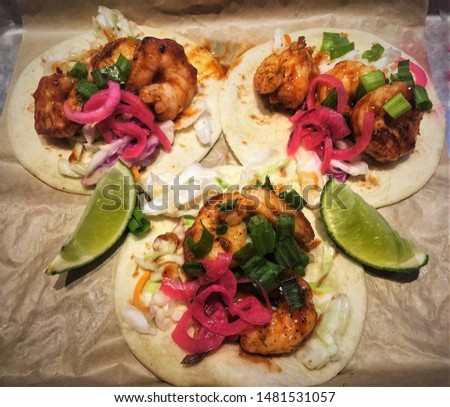 Three Barbeque Shrimp Tacos with Lime