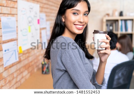 working creative asian woman dark skin portrait photo half body with meeting room office background