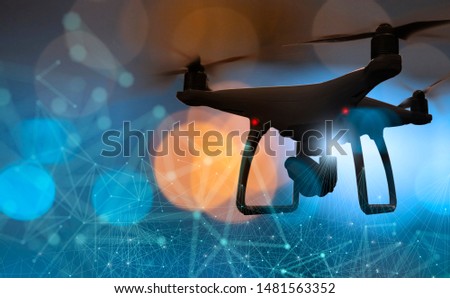 Drone quad copter with high resolution digital camera on the abstract city background.