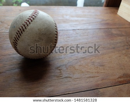 old baseball on wood table 