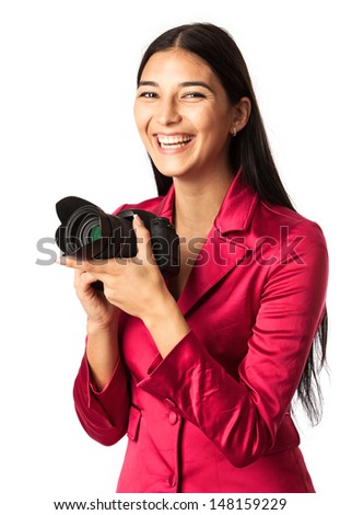 Young cheerful woman with a camera over white