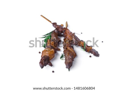Grilled beef meat with rosemary and pepper isolated on white background