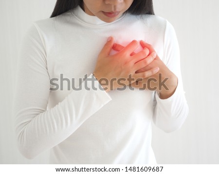 heart failure in woman and she press her chest symptom of pain and suffering cause of arrhythmia and bradycardia use for medicine product and health care concept on white background. Royalty-Free Stock Photo #1481609687