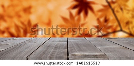 Empty wooden table with autumn for a catering or food background with a country outdoor theme,Template mock up for display of product