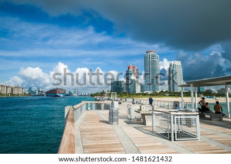 Bright scenic morning view of the Miami skyline with gray storm clouds at Government Cut in South Beach