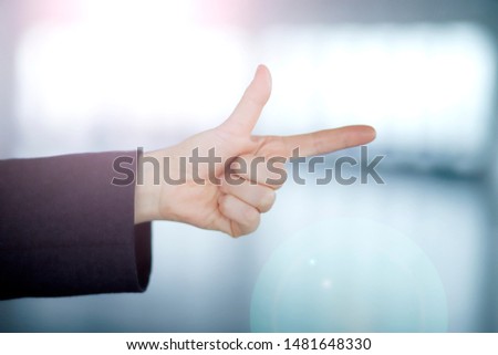 Cropped image of businesswoman pointing finger 