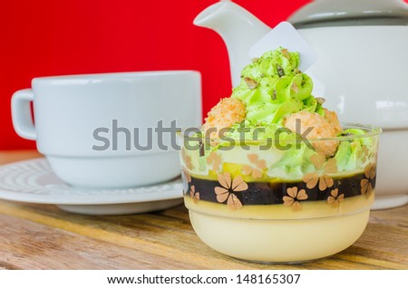 Green tea cake on the wood table with color background