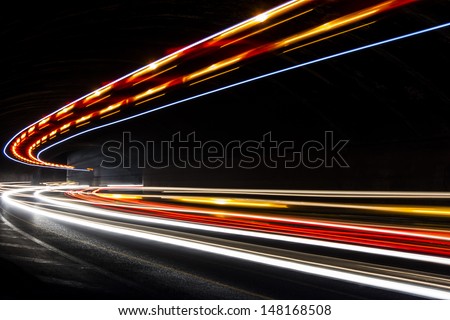 Car light trails in the tunnel. Very art image . Long exposure photo taken in a tunnel 