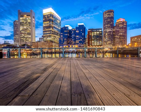 The architecture of Boston in Massachusetts, USA at night showcasing its Harbor and Financial District at downtown.