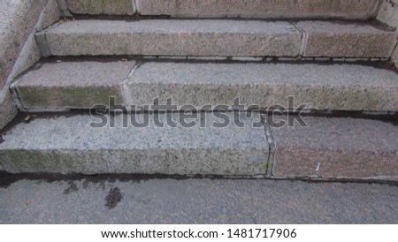 stairs of concrete slabs on the street after the rain
