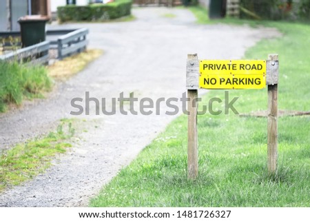 No parking private road sign on grass