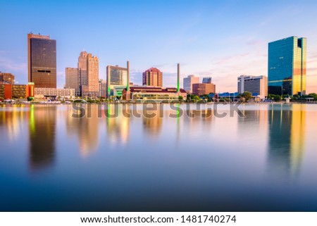 Toledo, Ohio, USA downtown skyline on the Maumee River at dusk. Royalty-Free Stock Photo #1481740274