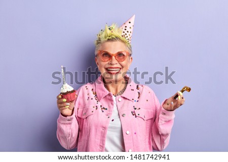 overjoyed excited old lady rejoicing at party, happiness, positive feeling and emotion, woman gets pleasure from holiday