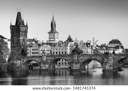 Sunset view on Prague old town, iconic Charles bridge and Vltava river, Czech Republic
