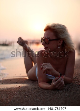 girl on beach. photo at sunset