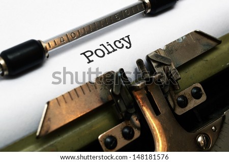 Policy on typewriter Royalty-Free Stock Photo #148181576
