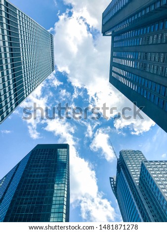 Buildings in business district , downtown  Montreal with blue sky and clouds in Summer.