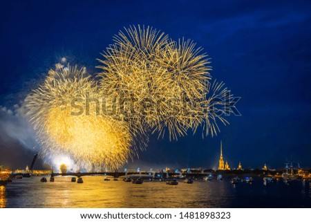 Russia. St. Petersburg on a festive evening. Fireworks over the Neva. Fireworks in the night sky. View of St. Petersburg holiday. Salute in honor of the holiday. Peter and Paul Fortress