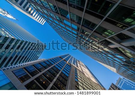 Modern office glasses buildings cityscape under blue clear sky in Washington DC, USA, outdoors financial skyscraper concept, symmetric and perspective architecture