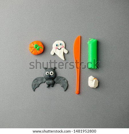 3d halloween set happy angry pumpkin bat ghost design handmade clay on gray background. Creative seasonal holiday DIY concept