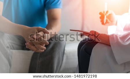 Digital healthcare  concepts. Doctor physician team meeting consulting work together using new technology tablet to view medical x-ray with patient chart in hospital. Mens' health in Movember. Royalty-Free Stock Photo #1481972198