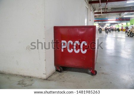 Firefighting box with sand in underground parking of modern building