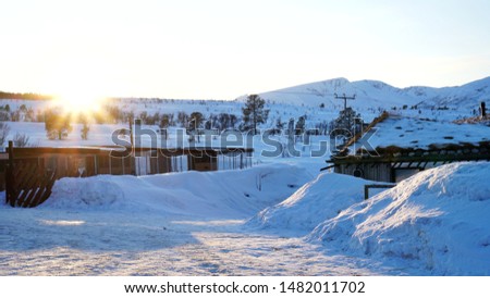 Beautiful sunset at traditional houses in winter of Norway 