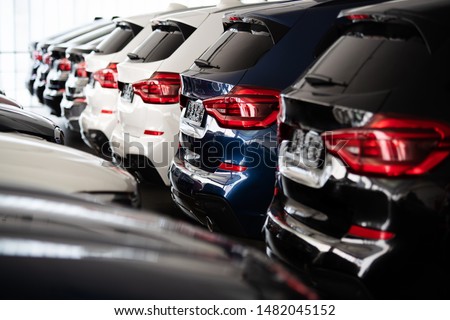 new cars in a row at the dealership Royalty-Free Stock Photo #1482045152
