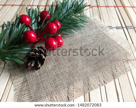 Christmas tree, berries on a light background.