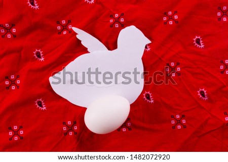 Chiken with egg made of paper and real egg