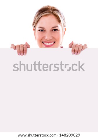 Happy woman holding a banner and smiling - isolated over white 