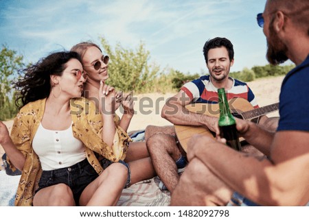 Friends having great fun on the beach 