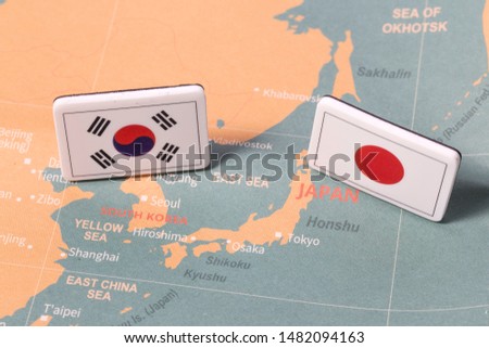 South Korea and Japan flags on map Royalty-Free Stock Photo #1482094163