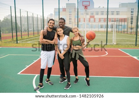 Group of young professional intercultural basketball players in sportswear