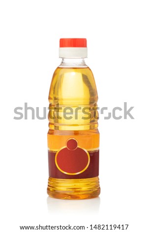 Plastic bottle with lamp oil on white.