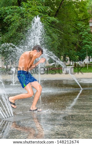 The boy in the fountain. Stock Photo