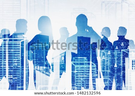 Silhouettes of business people over night and virtual city background with double exposure of social network interface. Concept of HR and hiring. Toned image