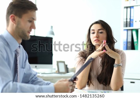 Portrait of businesswoman waiting decision about signing international statement. Beautiful woman discussing conditions of contract. Business concept. Blurred background