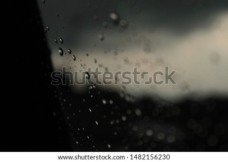 raindrops on a window of a car